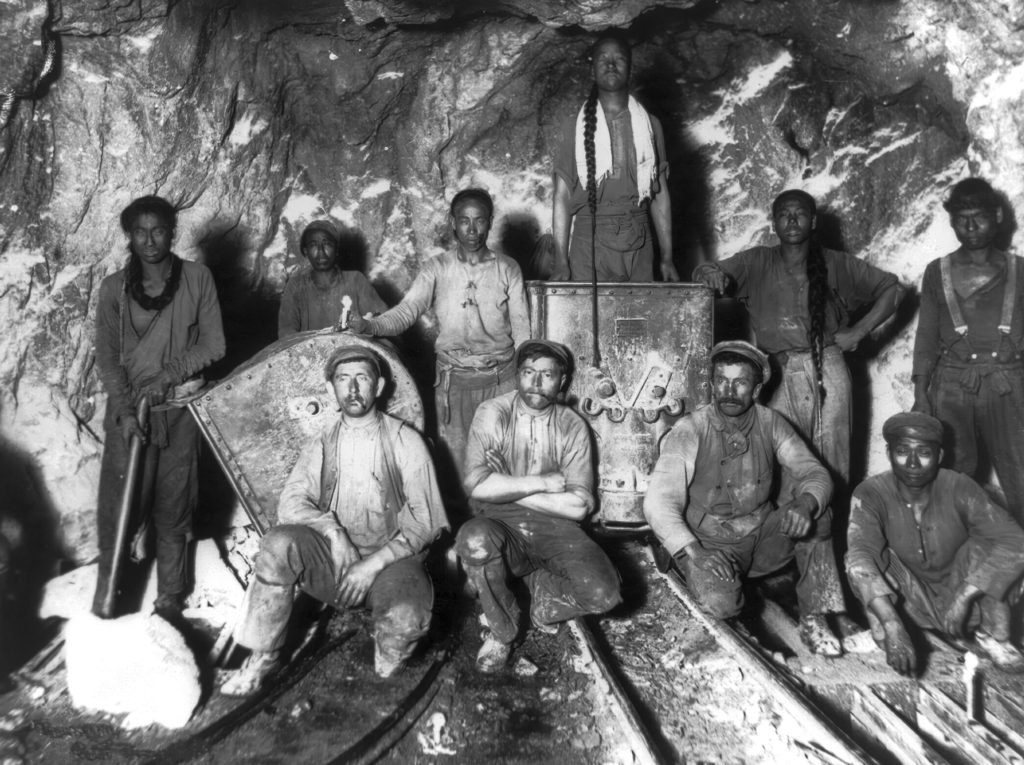 Black Chinese and White labourers in a gold mine in South Africa